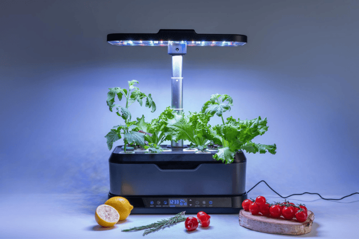 Smart Vertical Garden using LED grow lights to cultivate leafy greens and tomatoes indoors, showcasing efficient home gardening technology.